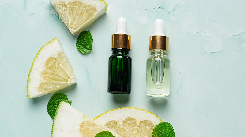photo of lemon essential oils lay on the top of table
