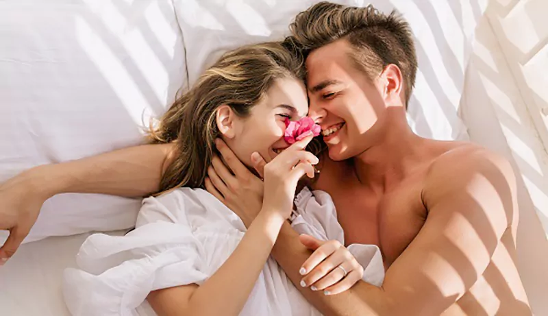 couple snuggling in bed