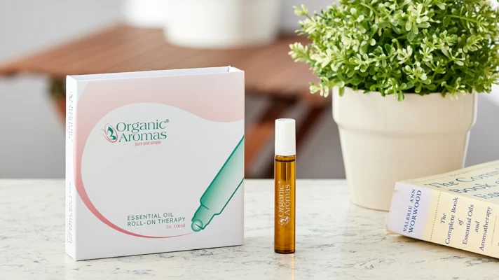 photo of a set roll-on essential oil and a single roll-on essential oil on the top of marble table