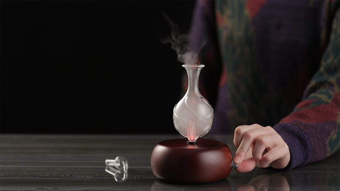 photo of people adjusting volume control nebulizing diffuser