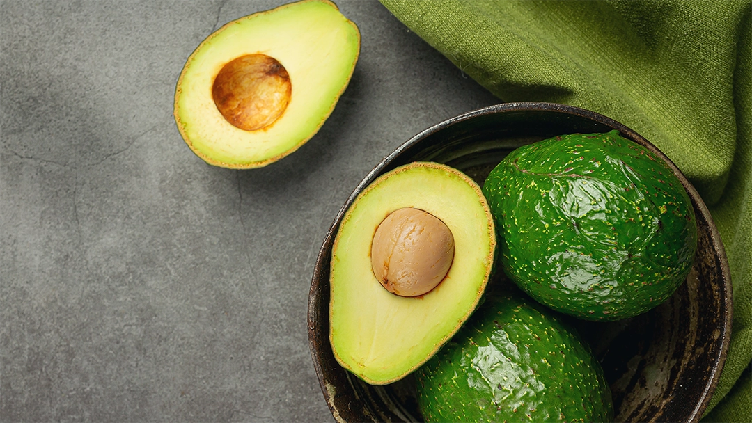 Fresh and Vibrant Several Avocados in a Bowl