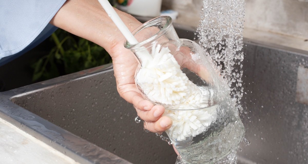 scrubbing glass bottle