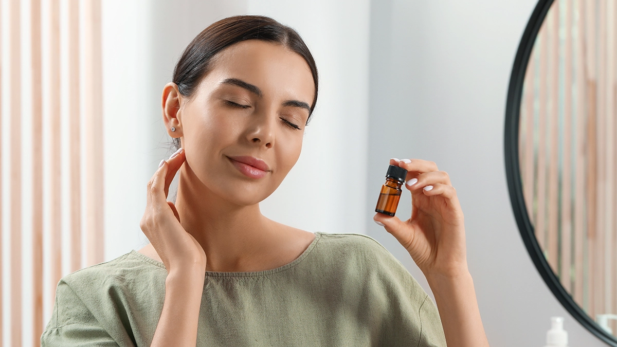 A woman enjoying the scent of essential oils to clear sinuses